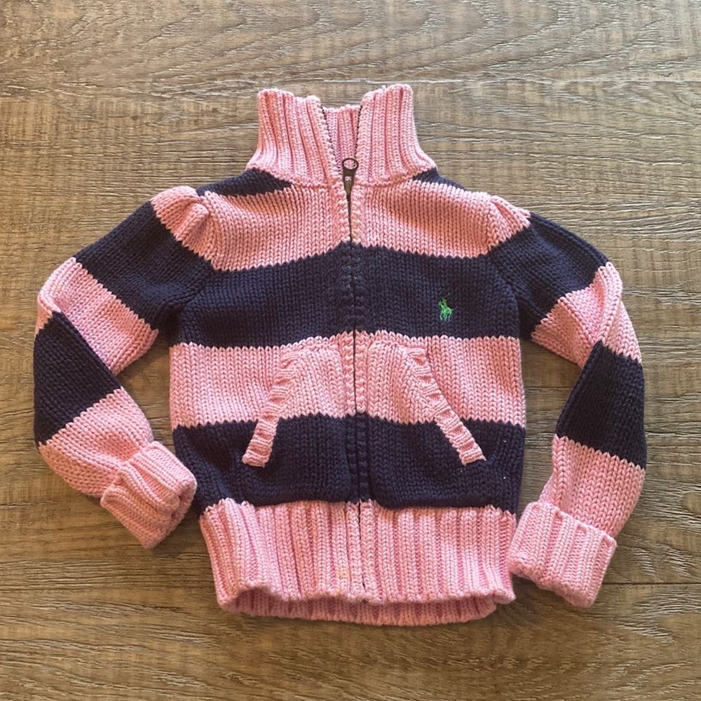 Ralph Lauren zip up sweater in a baby pink and navy blue stripe. Size 2T.